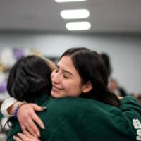 Girls of Color Summit previous event two attendees hug